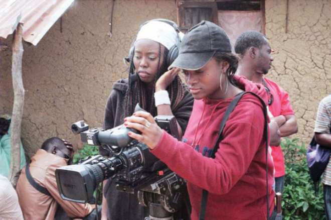 National Film Institute female camera and sound crew set up on location in Lamingo.