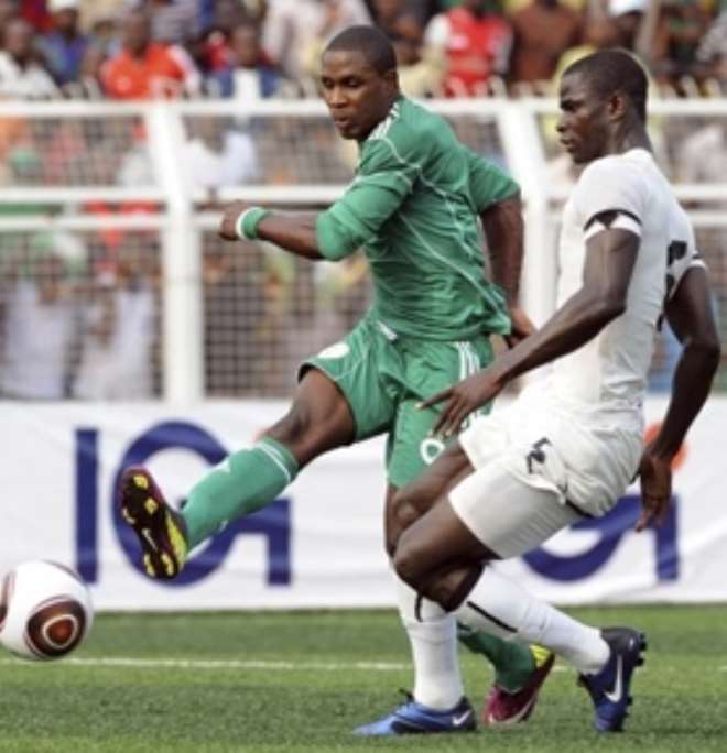 Odion Igalo of Nigeria (left) and Jonathan Mensah of Ghana