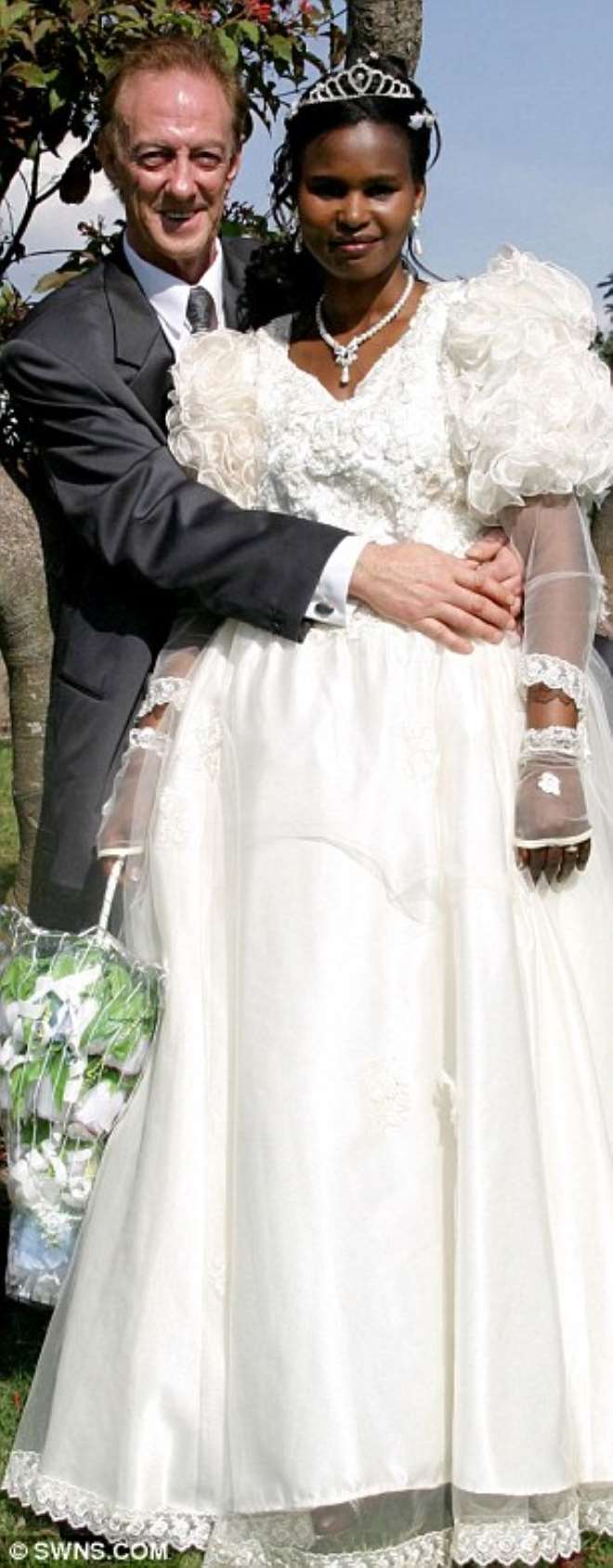 Tim Reeves, 58, with his ex-wife Priscila Njoki Njenga on their wedding day in Kenya in October 2008