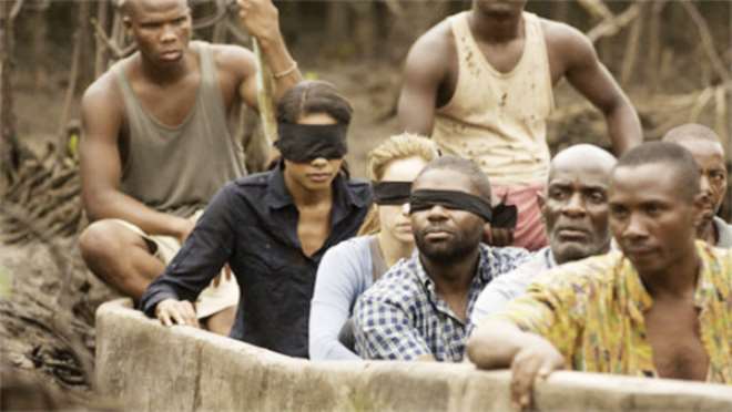 Naomie Haris, Jodhi May and David Oyelowo are blindfolded in this scene from Blood and Oil