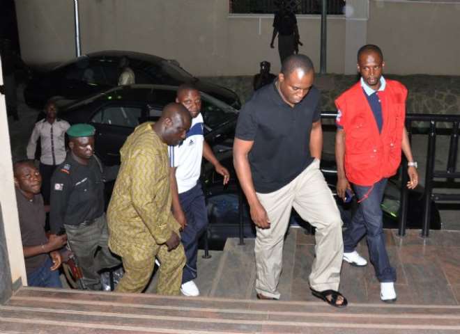 Former Speaker of the House of Representatives, Dimeji Bankole, (second right) with operatives of the EFCC on arrival at the commission’s office in Abuja ... on Sunday