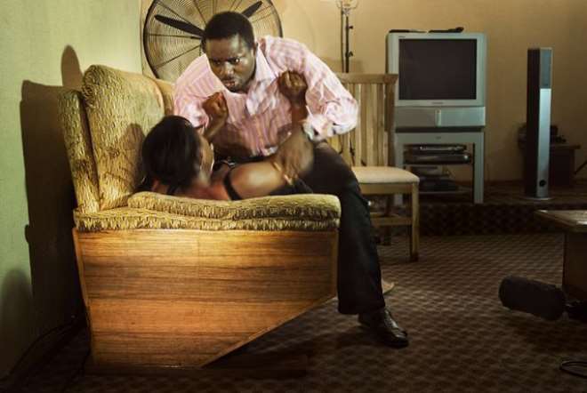 Film actors Emeka Ike, playing a wealthy businessman, and Ufuoma Ejenobor, playing the wife of his business partner,on the set of a Nollywood movie production,played same in real life