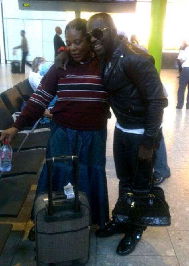 Jim Iyke spotted at the airport with his mum.