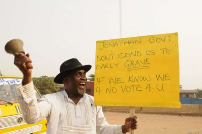 Kunle Okoosi leading a one-man protest on the removal of gasoline subsidy in Sango ota, Ogun State