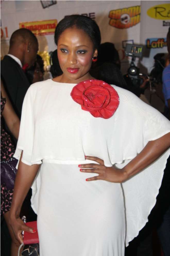 A confident Uru Eke... looking divine in white (with a touch of red) by House of Dorcas.